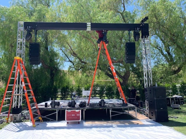 Crew building an outdoor stage