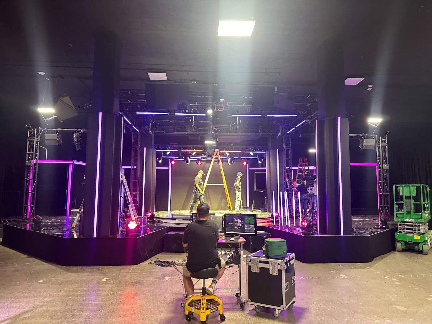 A venue being wired with truss and fixtures